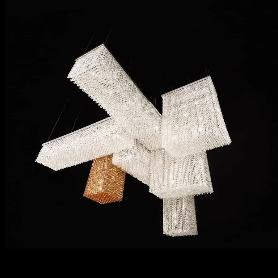 Distinguished Masiero Cubo suspension lamp with a shiny chrome metal frame and exclusive transparent crystal pendants including a golden prism