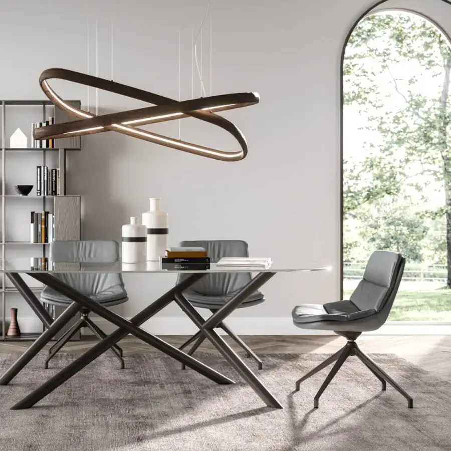 Superior Ozzio Italia Random table with clear glass top and dark metal geometric base crafted with welded joints