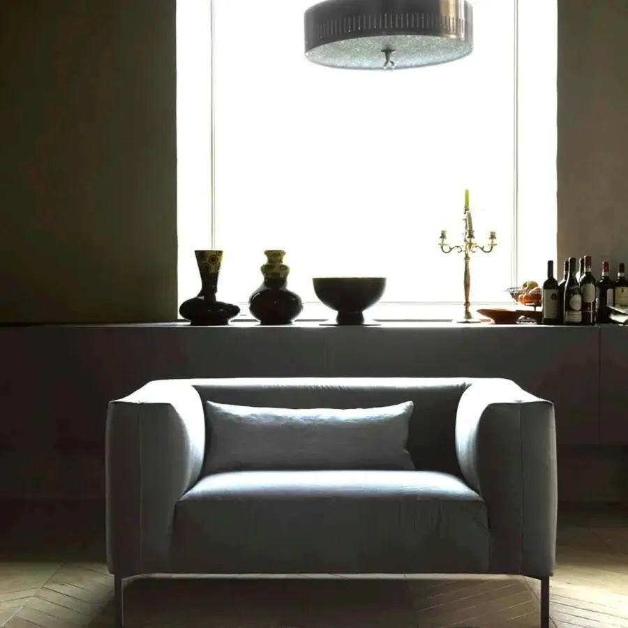 Superior Verzelloni Fold sofa with matte gray textile upholstery and grey-matt painted cast metal feet