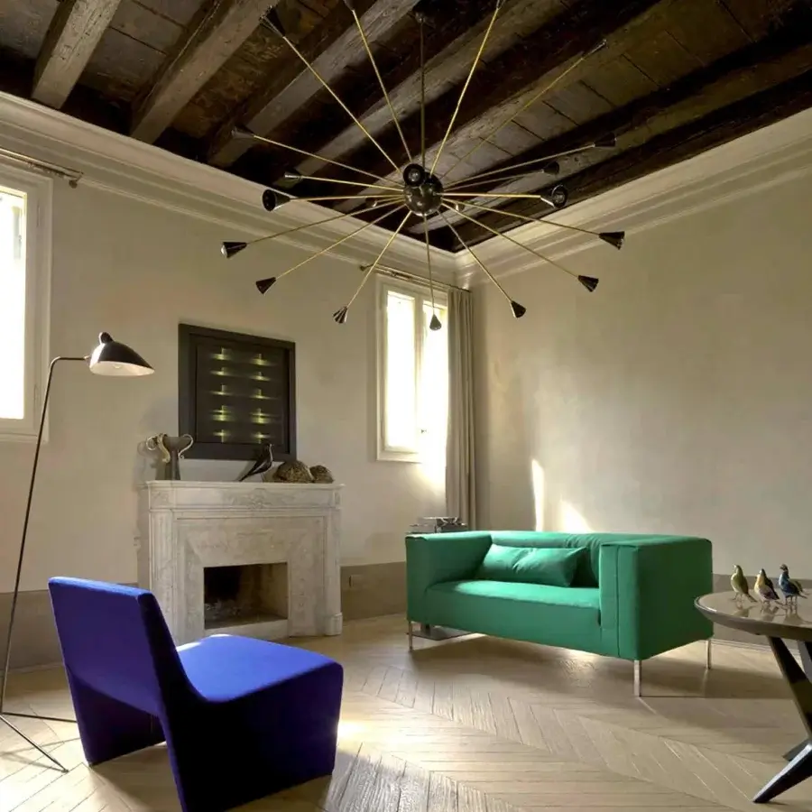 Elegant Verzelloni Fold sofa with refined green textile upholstery and grey-matte painted metal legs crafted with solid wood