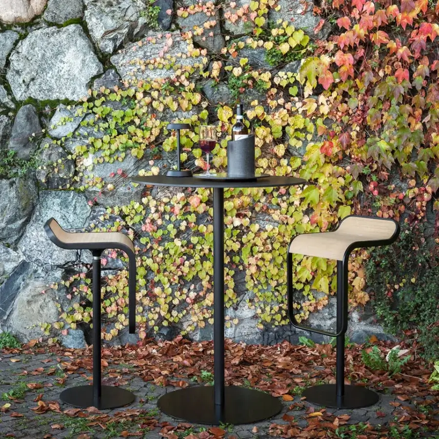 Elegant Lapalma Lem stool with a curved light-toned wood seat and sleek black powder coated stainless steel frame