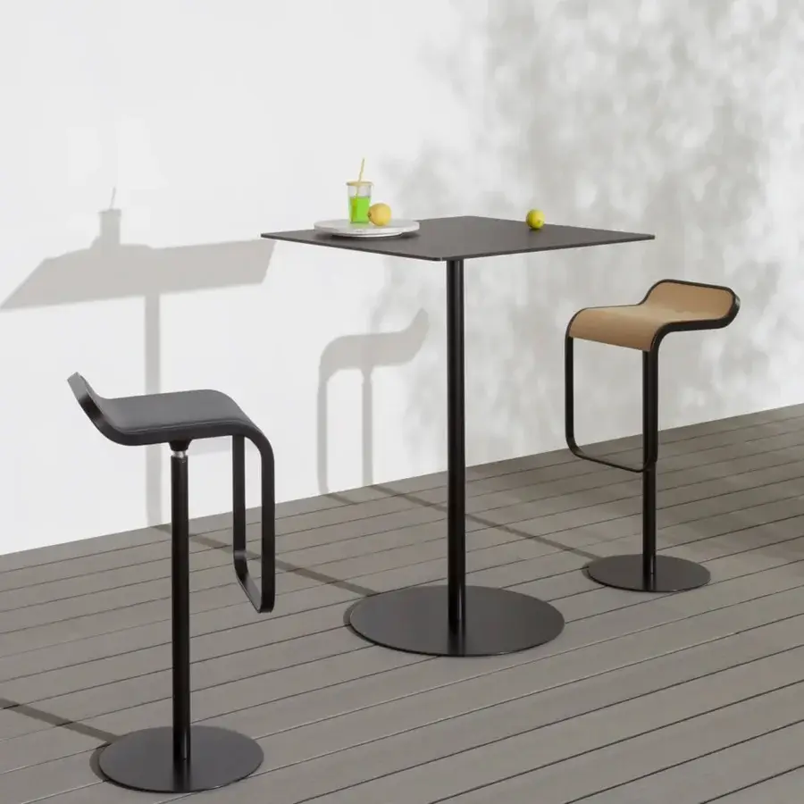 Sophisticated Lapalma Lem stool with a gracefully curved seat in light brown Iroko wood and a sleek matte black powder-coated stainless steel frame