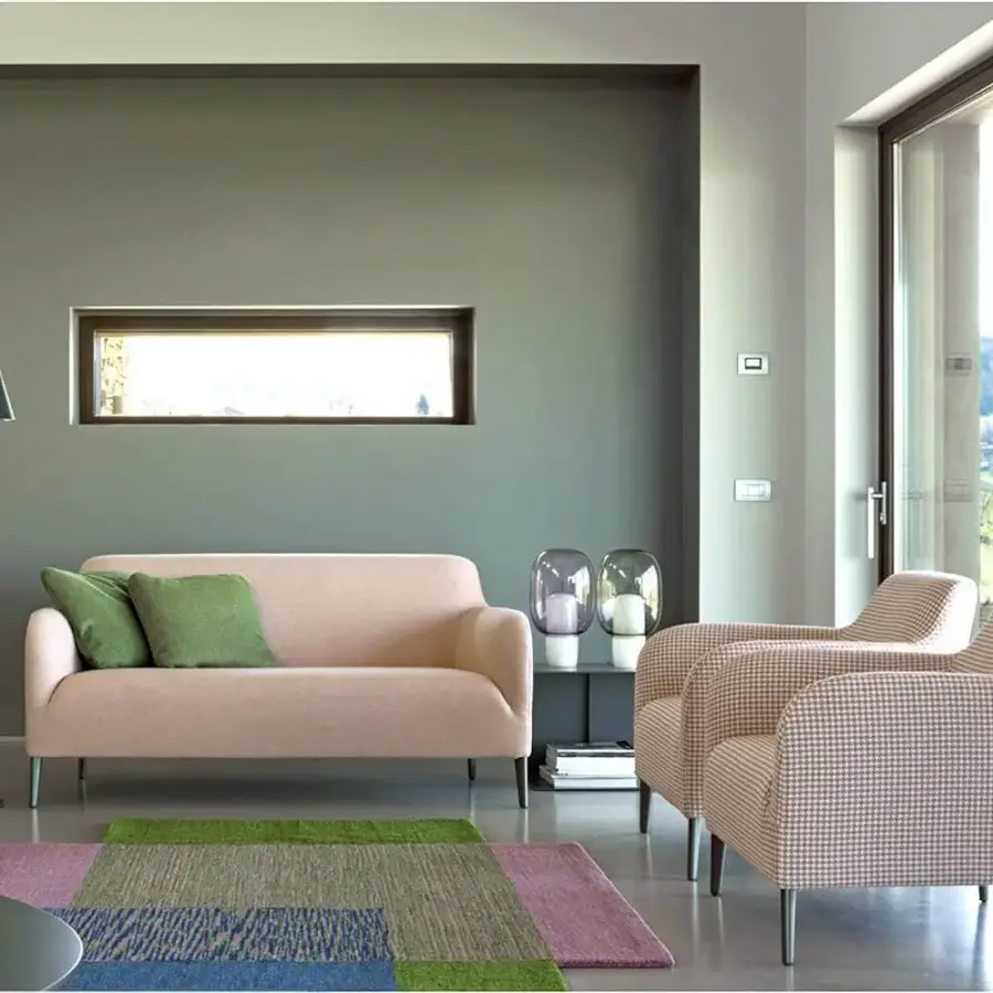 Lavish Verzelloni Divanitas sofa with light pink textile upholstery and burnished cast aluminum legs