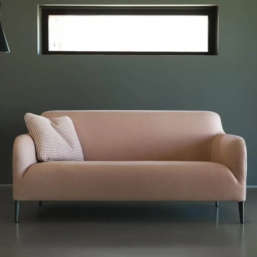 Distinguished Verzelloni Divanitas sofa with a curved silhouette upholstered in muted rose textile and burnished cast aluminum legs