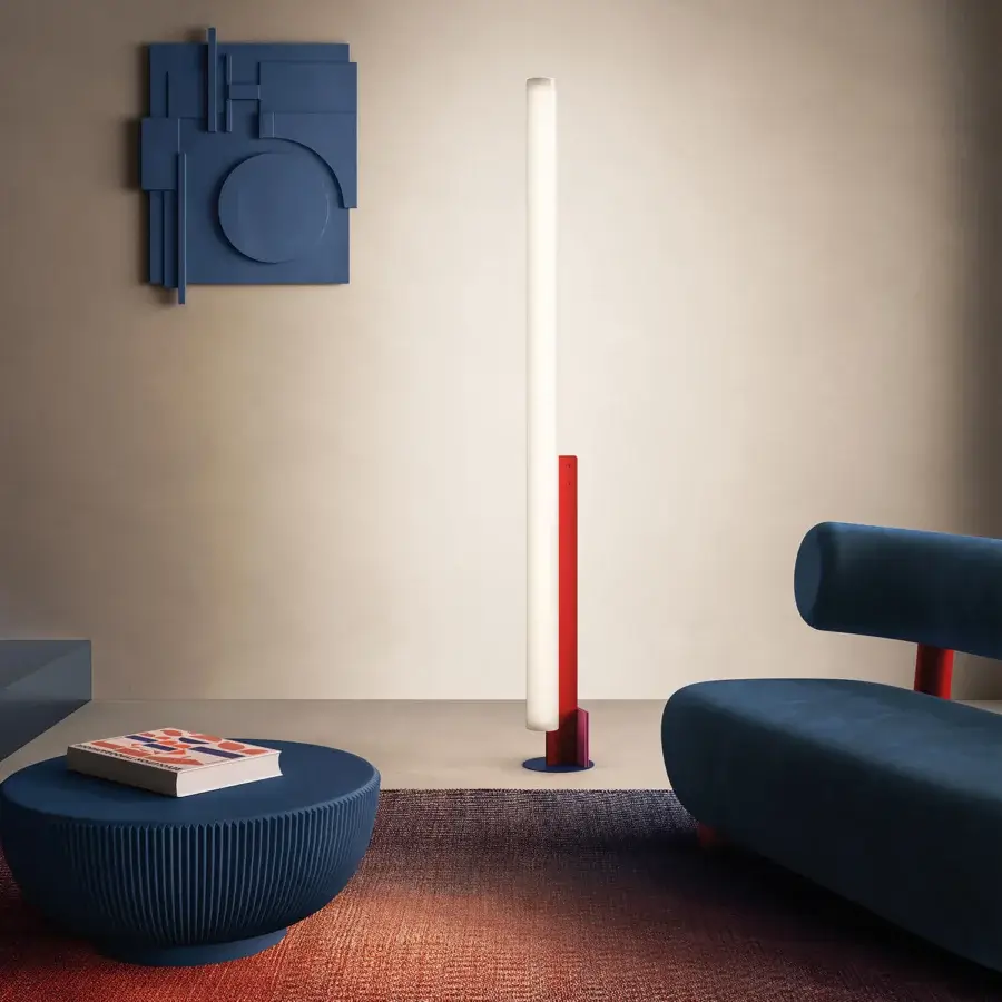 Exceptional Kundalini Model T floor lamp with a metallic coated structure, white opal diffuser, red support and blue base