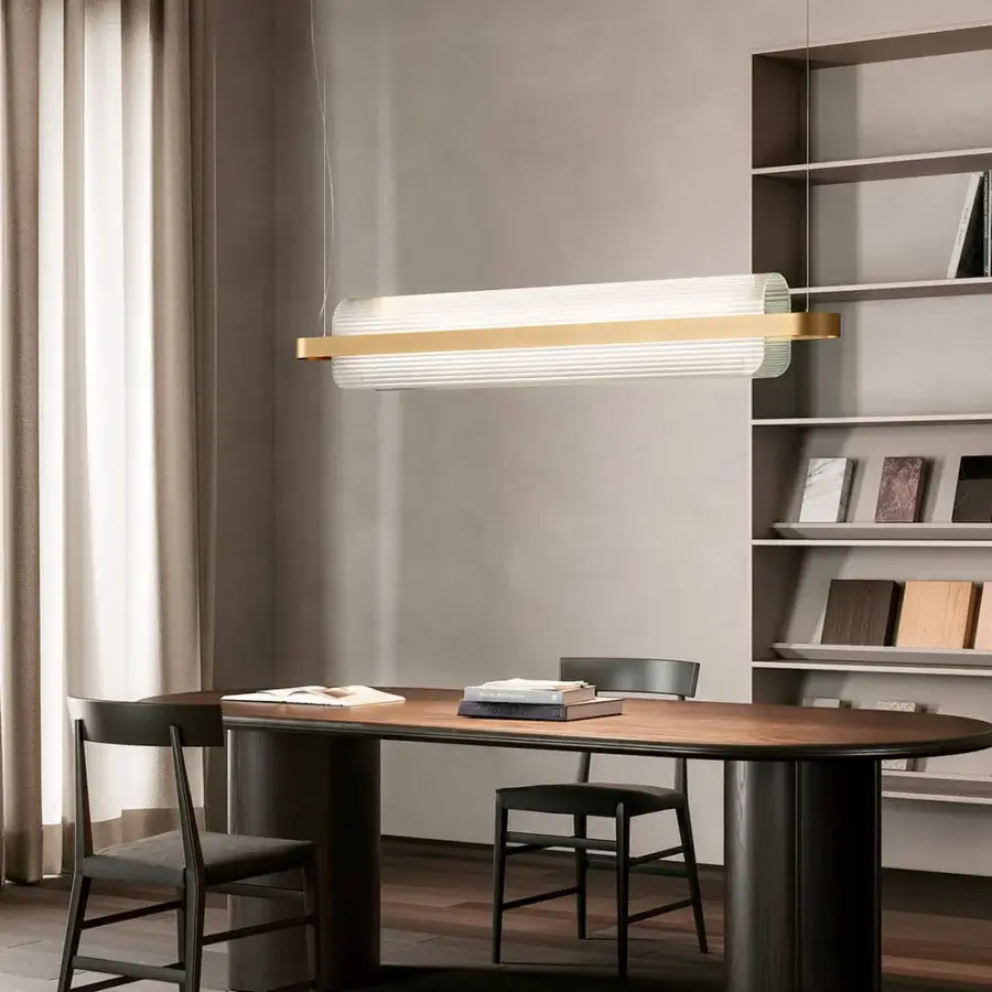 Captivating Kundalini Nami suspension lamp with textured curved glass and lustrous gold-toned metallic structure
