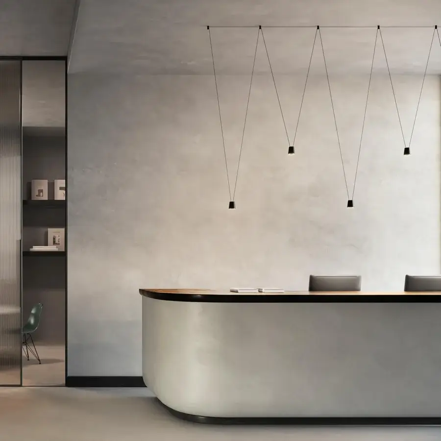 Exceptional Kundalini Sling suspension lamp with die-casted aluminum and thin black cords creating inverted geometries