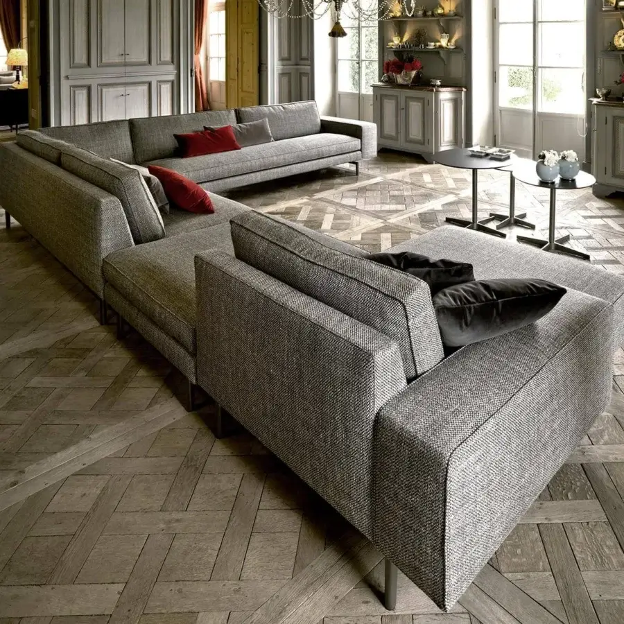 Elegant Verzelloni Irving sectional with textured light gray textile and bronzed painted aluminum cast feet