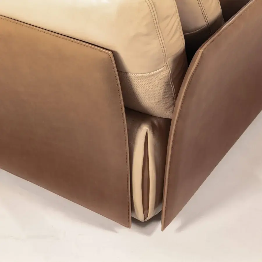 Superior Cierre1972 Tab sectional with warm tan leather and lighter beige accents exhibiting tailored stitching