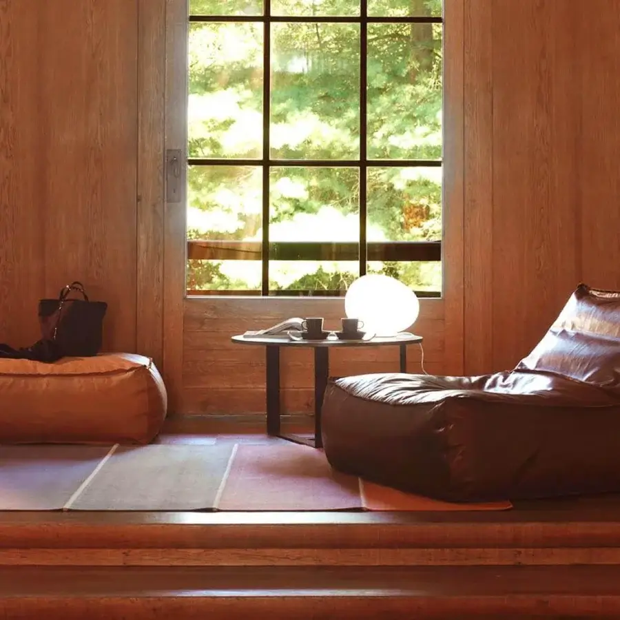 Distinguished Verzelloni Zoe lounge chair with glossy dark brown leather upholstery and visible seams