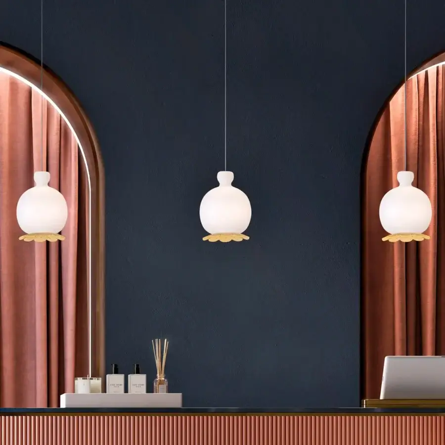 Superior Kundalini Opyo suspension lamp with a spherical white opal diffuser and golden petal-like support crafted from mouth blown glass