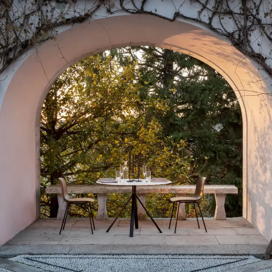 Exceptional Lapalma Fork Outdoor table with a round white HPL laminate top and slender black aluminum base crafted with adjustable nylon glides