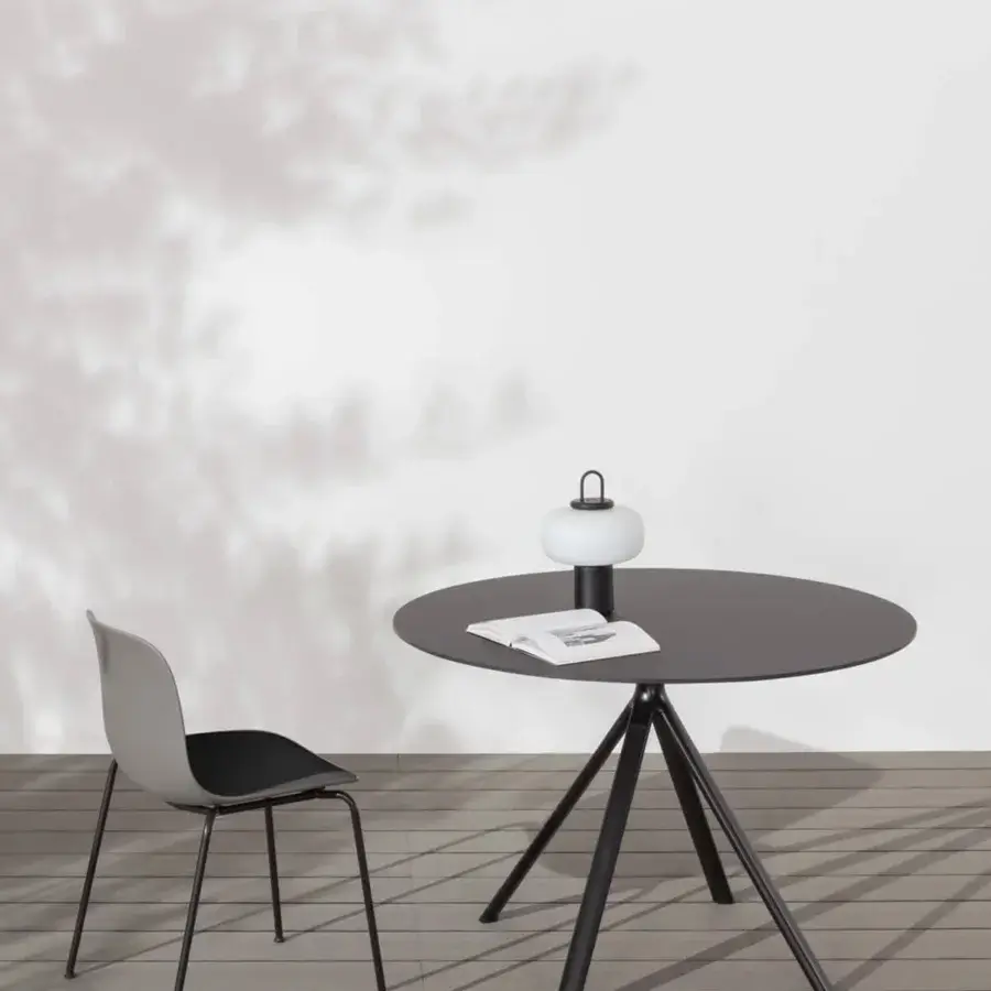 Superior Lapalma Fork outdoor table with a dark gray HPL laminate top and slender powder-coated aluminum base