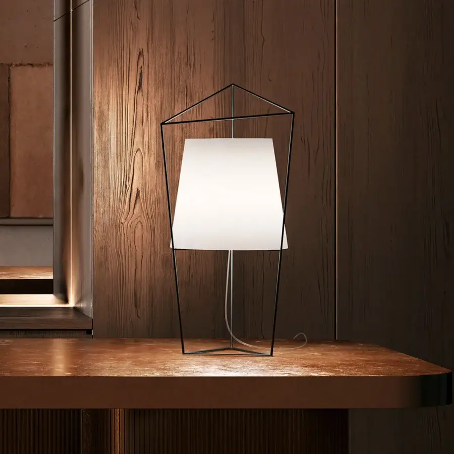 Elegant Kundalini Tatu table lamp with a black coated structure and dual-layer mouth blown glass opal diffuser