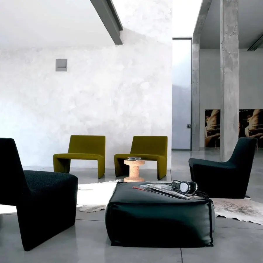 Distinguished Verzelloni Patty lounge chair upholstered in dark gray matte textile with black MDF feet and metal insert