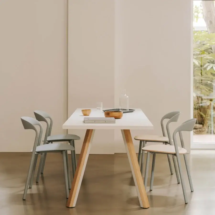 Distinguished Lapalma Ori table with a white HPL Fenix® top and slanted legs crafted in bent metal and solid ash wood