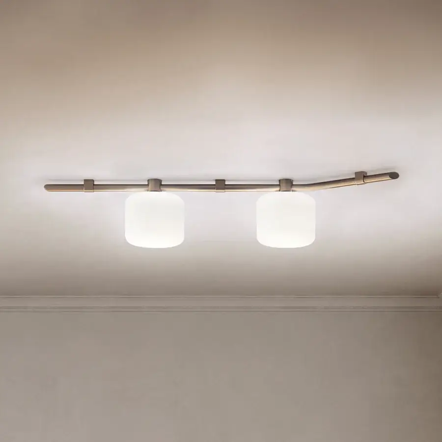 Captivating Kundalini Floed ceiling lamp with a luminous opal diffuser and light brass-colored metallic coated structure crafted in Italy