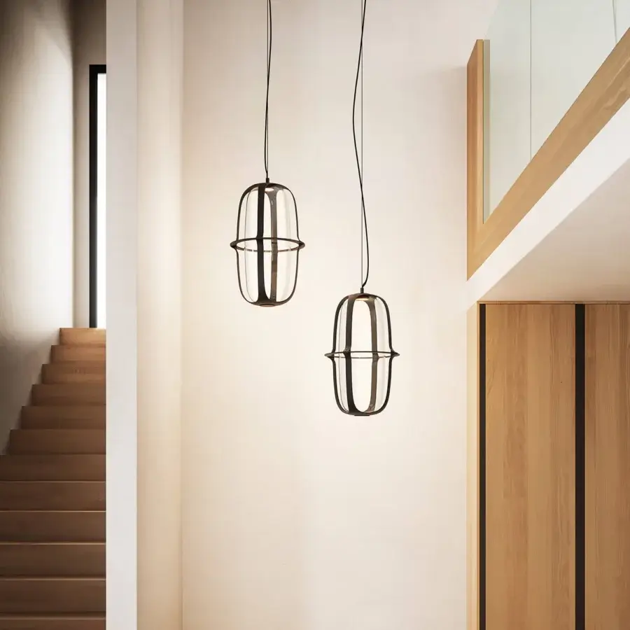 Exceptional Kundalini Kooi suspension lamp with transparent glass diffuser encased in dark die-casted aluminum structure