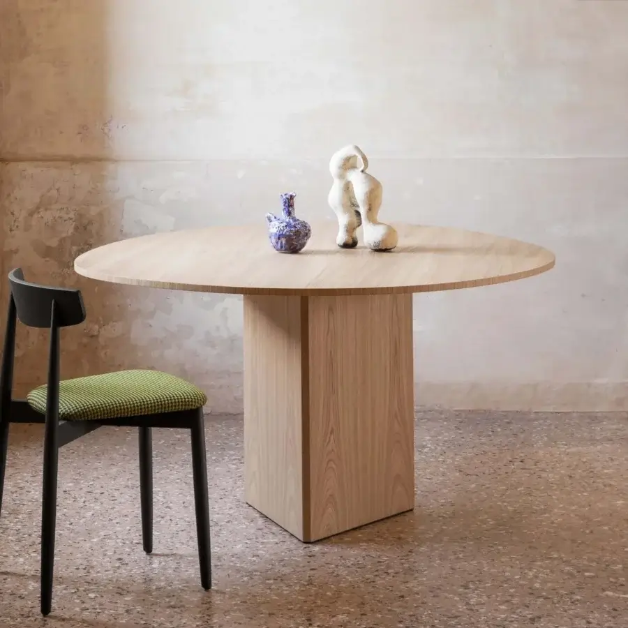 Distinguished Miniforms Albio table crafted in wood with light matte finish supports a round top with a sleek faceted triangular base