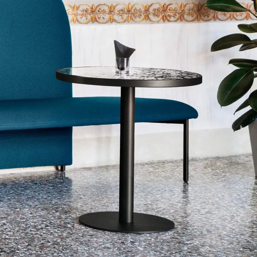 Distinguished Miniforms Briscola Bistrot table with an oval patterned tabletop and slender black metal base crafted in Italy