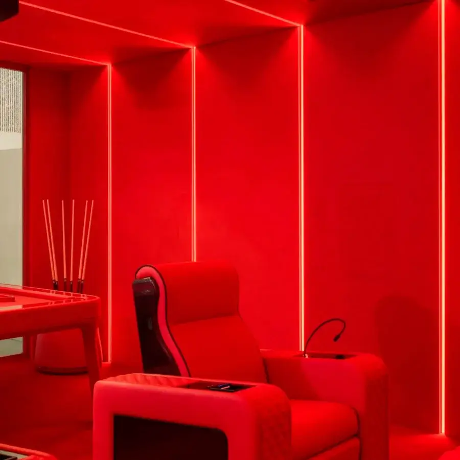 Distinguished Vismara Luxor Tech home cinema seating upholstered in striking red fabric or leather with quilted armrests and glossy finishes