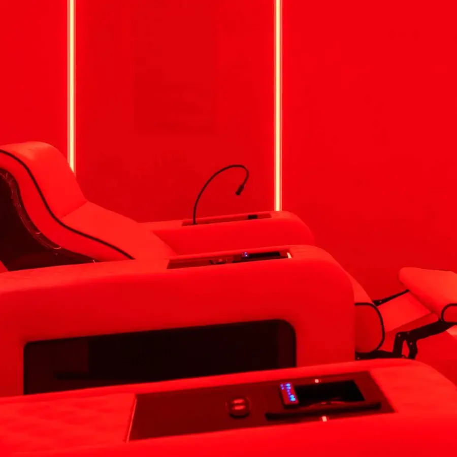 Exceptional Vismara Luxor Tech home cinema seating in vibrant red fabric or leather with lacquered wood armrests and chrome steel cupholders