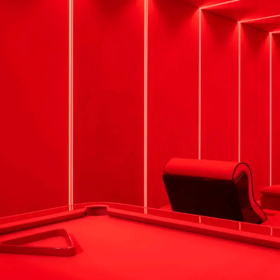 Distinguished Vismara Luxor Tech home cinema seating in red upholstery with glossy black lacquered wood and chrome steel cupholders