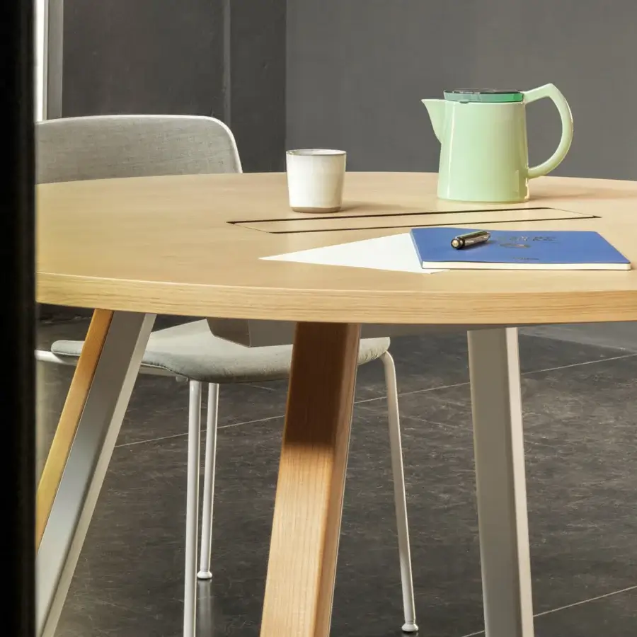 Distinguished Lapalma Ori workstation with a round wood top and light-colored powder-coated metal legs built with solid ash wood supports