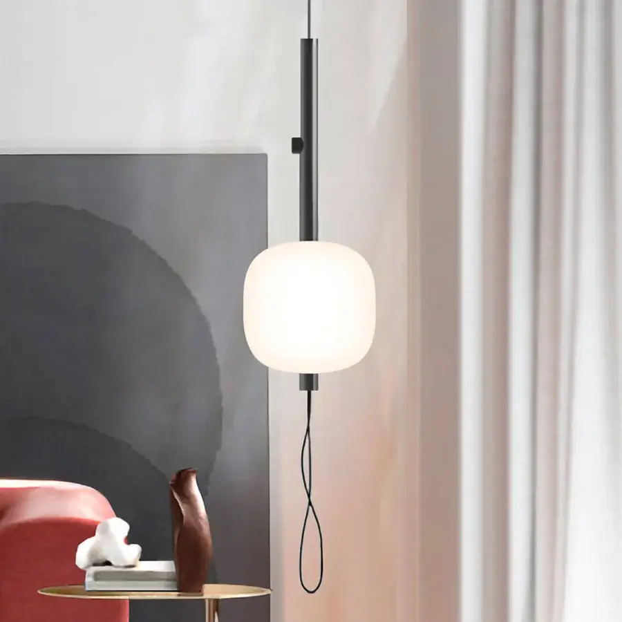 Exceptional Kundalini Motus suspension lamp with rounded opal glass diffuser and dark matte metallic structure