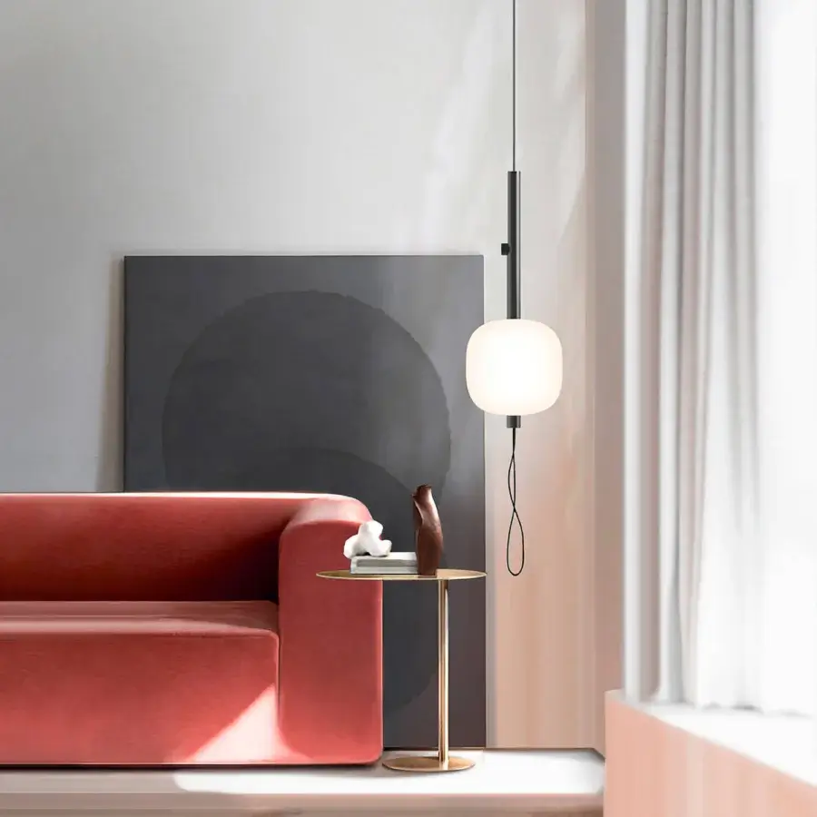 Distinguished Kundalini Motus suspension lamp with milky white opal glass and sleek matte black metallic structure
