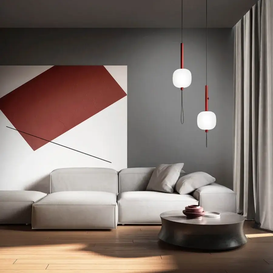 Exceptional Kundalini Motus suspension lamp with spherical opal glass diffuser and striking red metallic structure