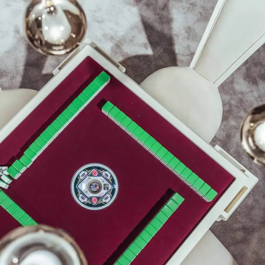 Exceptional Vismara Ming Mahjong table crafted with burgundy velvet, white lacquered structure and steel details for a seamless gaming experience