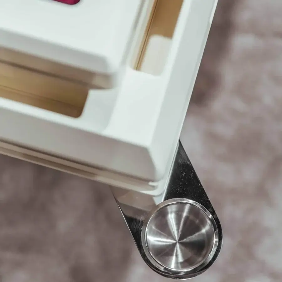 Superior Vismara Ming Mahjong table built with white lacquered structure, polished steel details and red velvet cloth