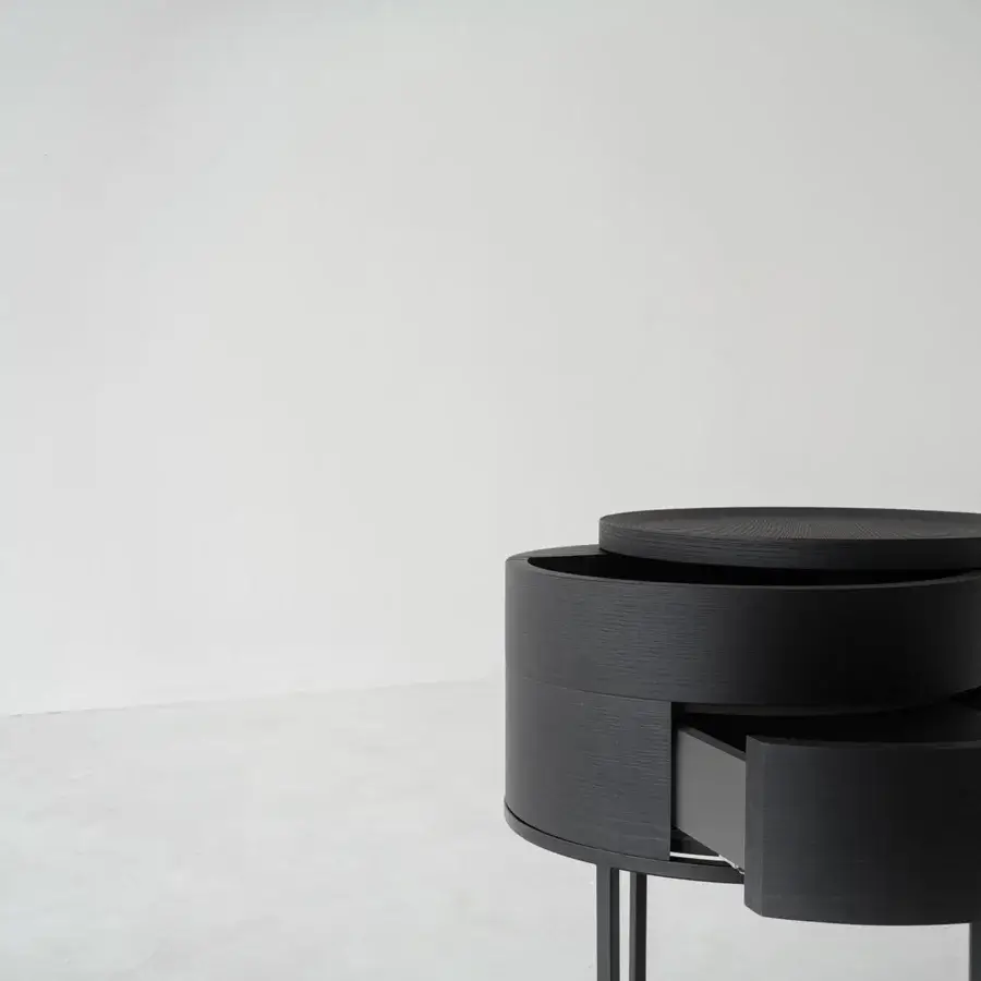 Elegant Cierre1972 Alfi nightstand in matte black showcases stacked cylindrical form with curved drawer front