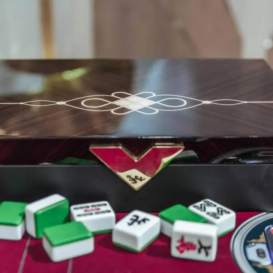 Distinguished Vismara Ming Mahjong table crafted with dark reddish-brown and black lacquered finish with steel details and white tiles