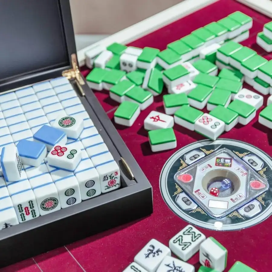 Superior Vismara Ming Mahjong table with red lacquer and steel details, a velvet playing surface, plus integrated USB ports and magnetic tiles