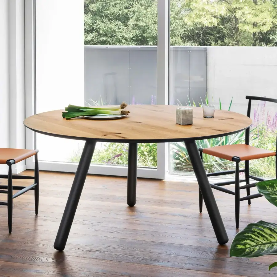 Superior Miniforms Pixie table with a light brown wooden top and sleek black edge supported by matte black cylindrical legs