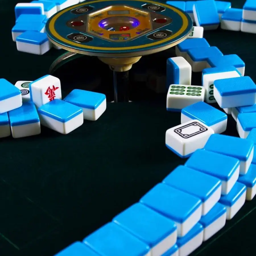 Exceptional Vismara Ming Mahjong table crafted in Italy with blue velvet cloth and lacquered structure featuring steel details and engraved tiles
