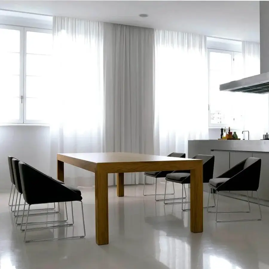 Elegant Verzelloni Kelly armchair with dark textile upholstery and chrome-finished metal sled base construction