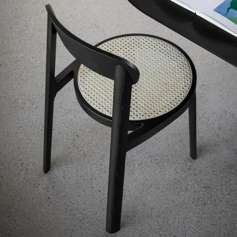 Distinguished Miniforms Brulla chair crafted in matte black wood with a contrasting cane-webbed seat for a retro aesthetic