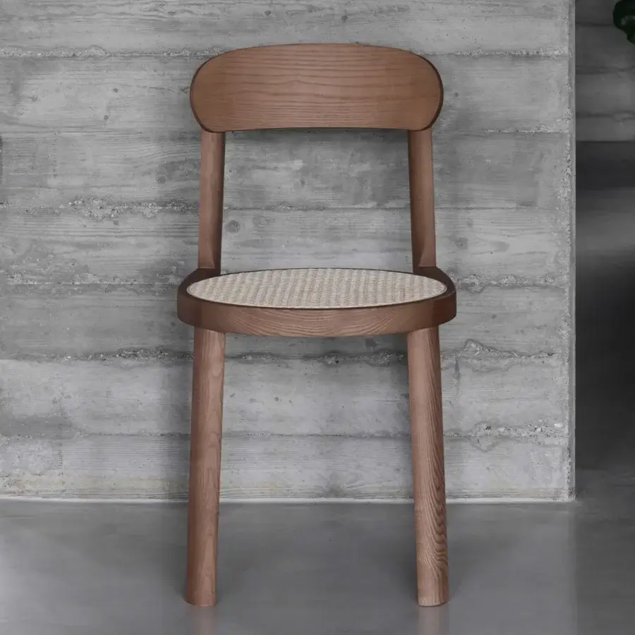 Exceptional Miniforms Brulla chair built in light brown wood with a light beige cane-webbed seat and matte finish