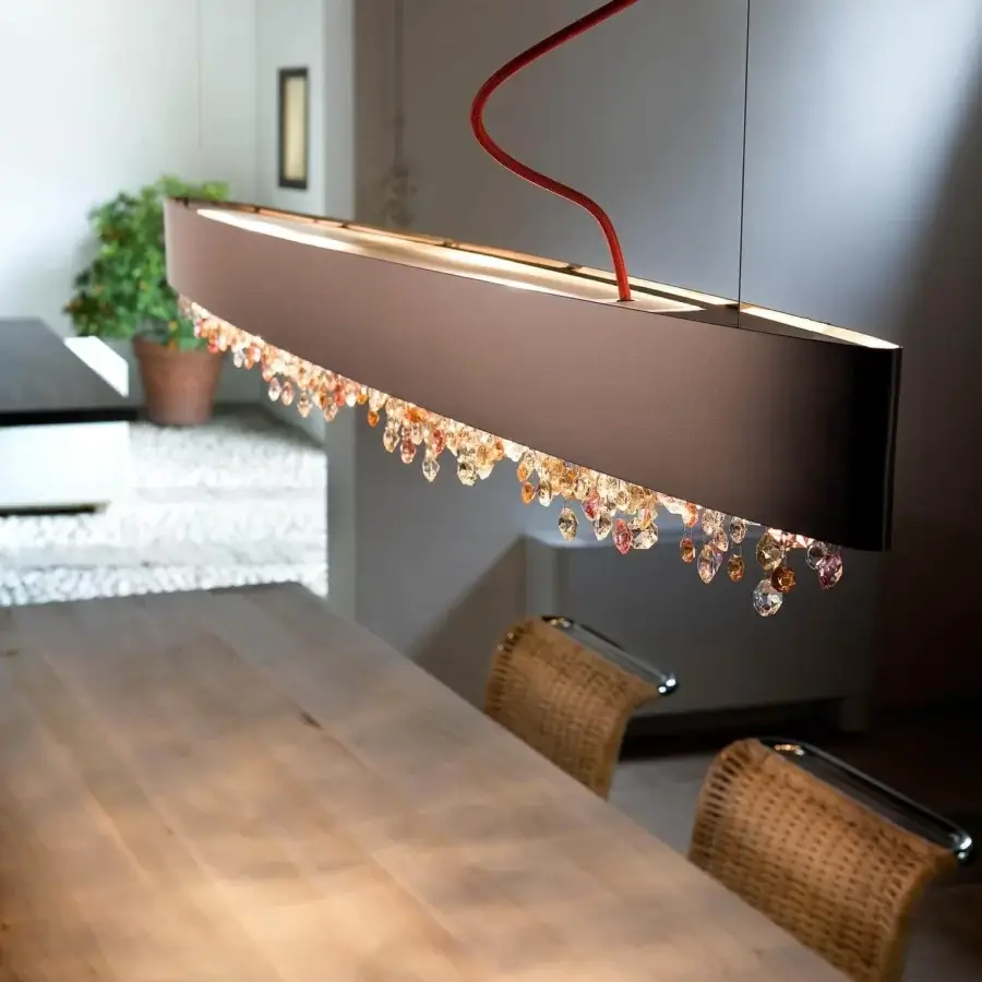 Exceptional Masiero Olà Ovale suspension lamp with a burnished frame and amber colored crystals showcasing orange and pink tones