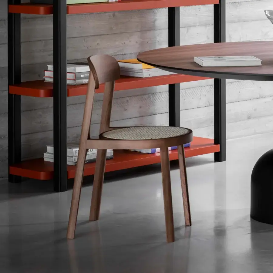 Distinguished Miniforms Brulla chair with woven cane seat and medium-brown wooden frame crafted in Italy