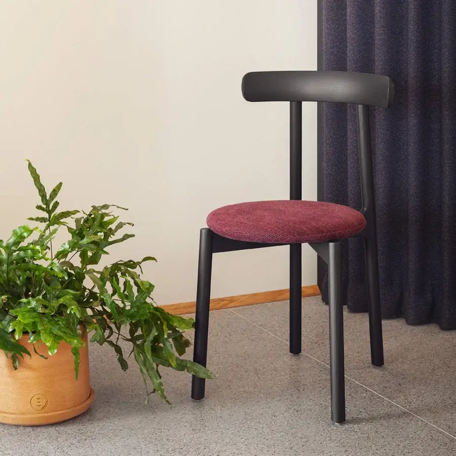 Superior Miniforms Bice chair with a unique flap-eared backrest upholstered in textured maroon fabric and matte black wood