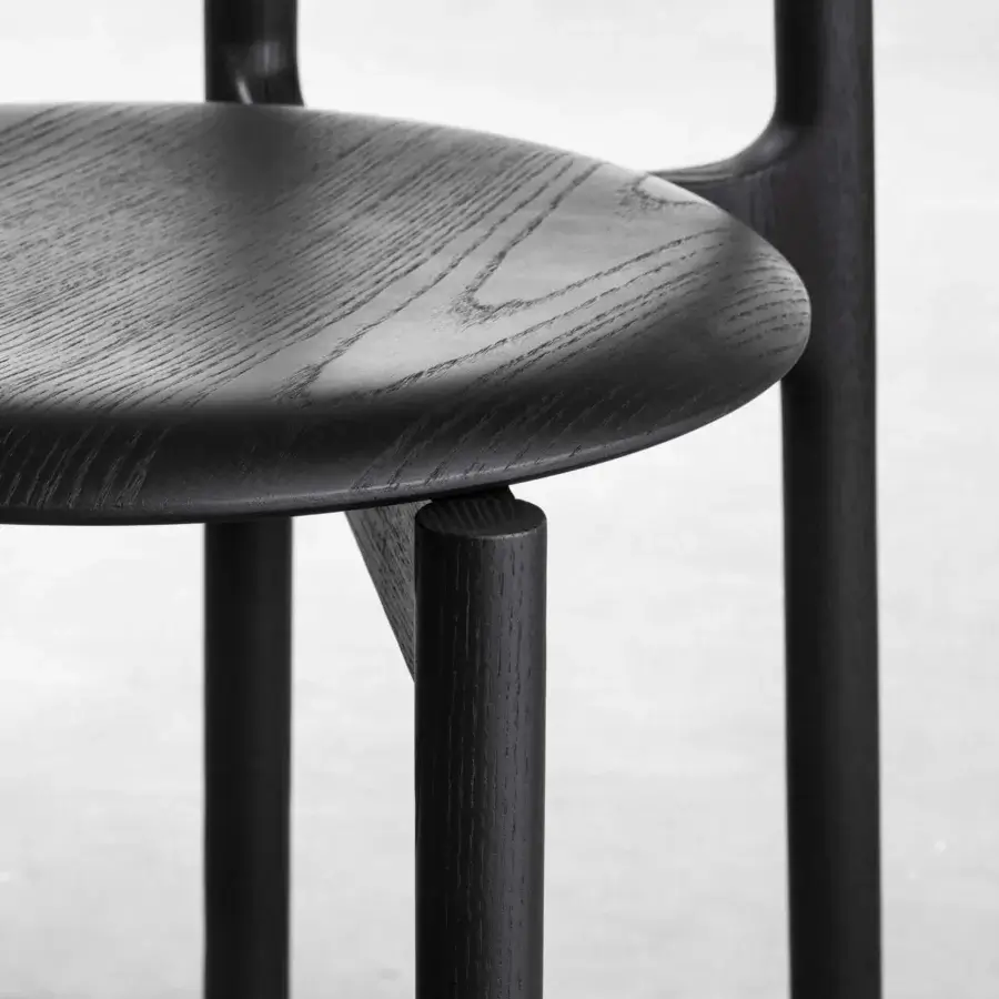 Distinguished Miniforms Bice chair in wood with a black finish accentuating visible grain and a unique backrest structure