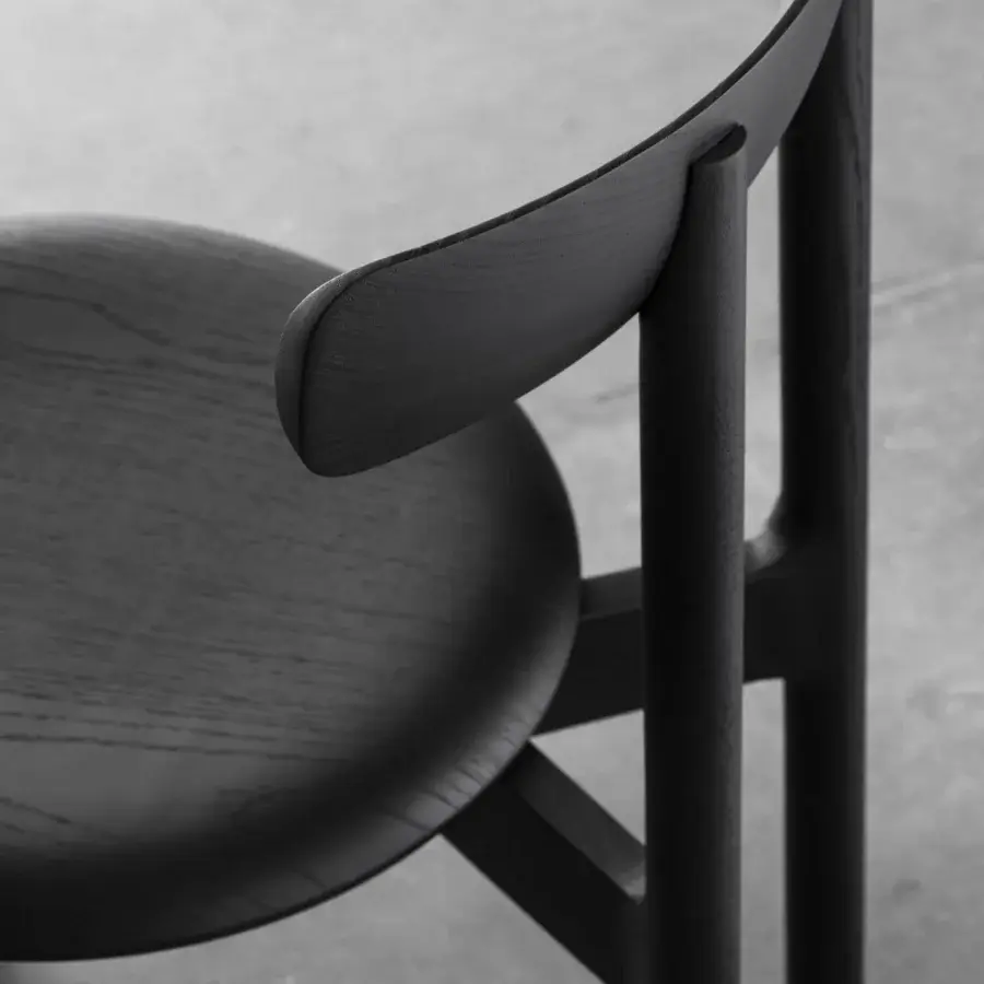 Exceptional Miniforms Bice chair crafted in Italy with a dark matte finish highlighting natural wood grain and distinctive backrest design