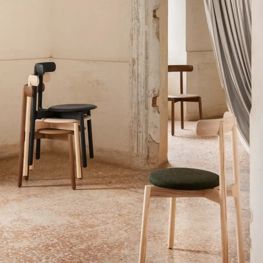 Elegant Miniforms Bice chair crafted in Italy with a natural wood frame and dark speckled green upholstered seat