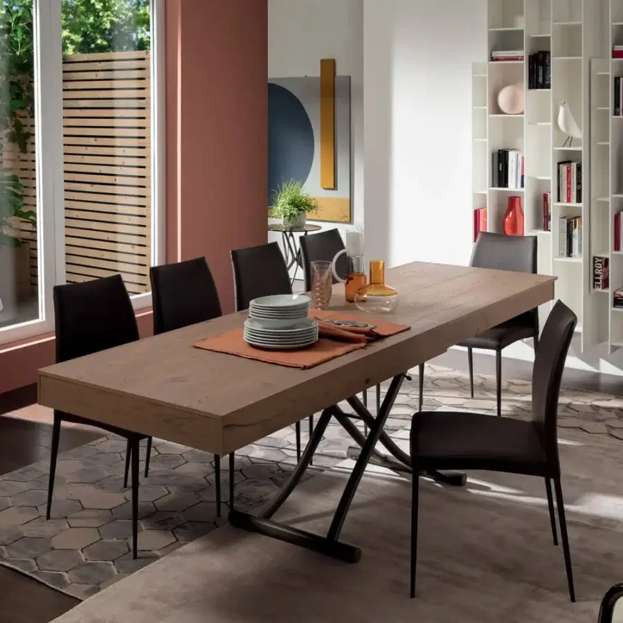 Innovative Ozzio Italia Newood transformable table with wood grain and crisscross metal base crafted in Italy