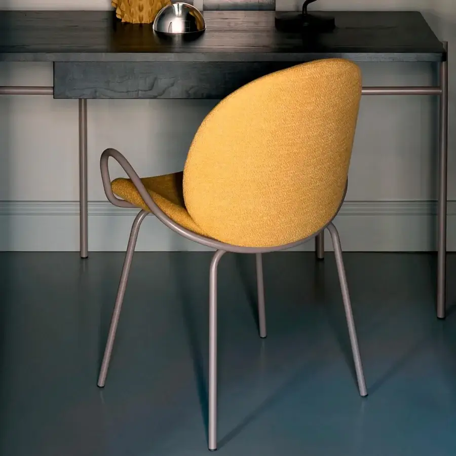 Exclusive Bross Baltea armchair with rounded silhouette fully upholstered in yellow textured fabric and light grey matte metal frame