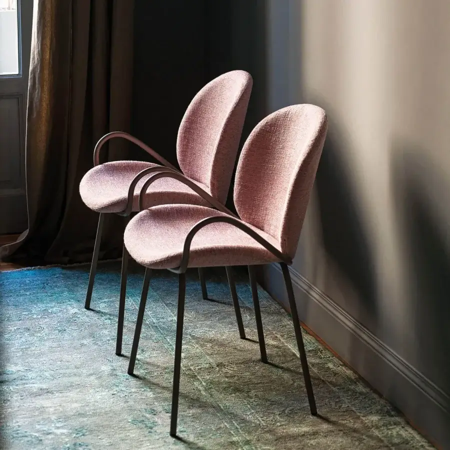 Elegant Bross Baltea armchair with metal structure fully upholstered in muted pink fabric exhibiting a textured matte finish